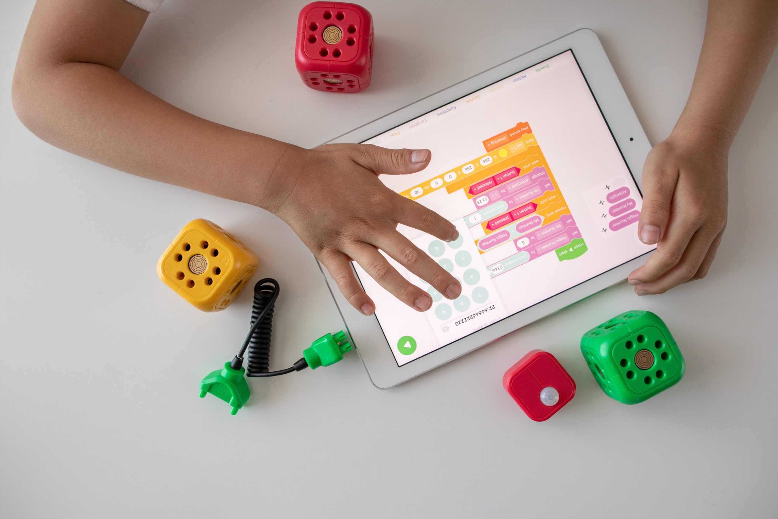 robo-wunderkind-hLvQ4-QEBAE-unsplash overhead view of person using tablet with schedule
